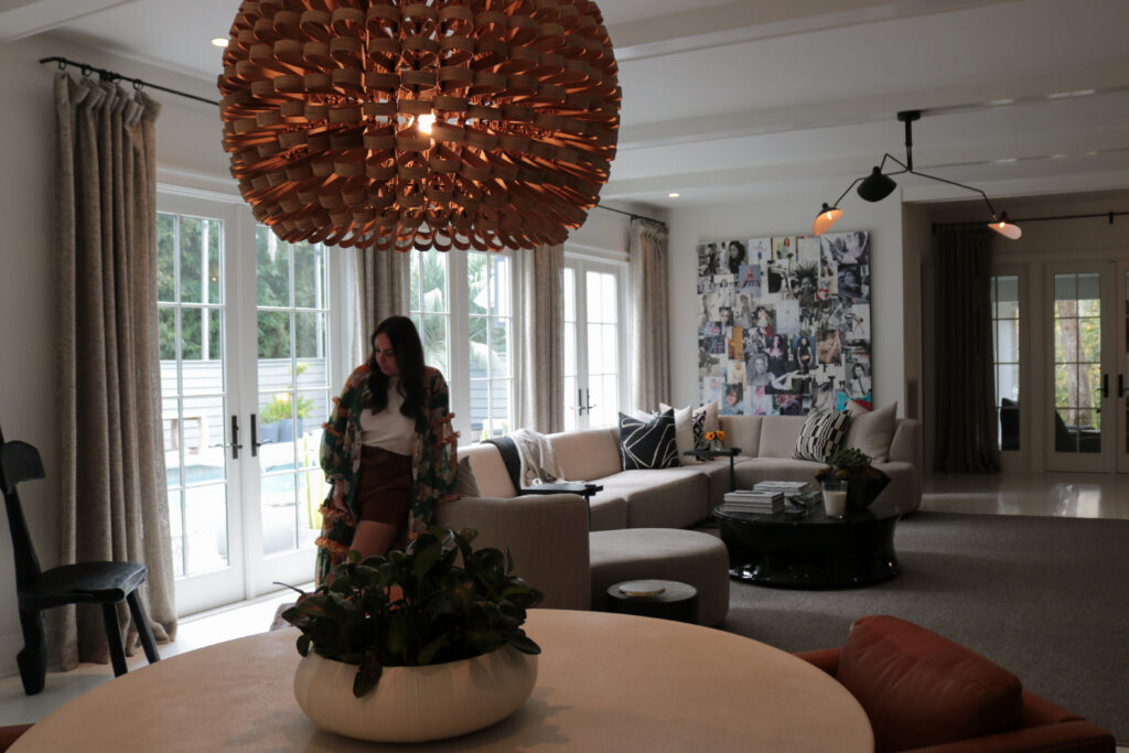 Photo of Valarie Dunn leaning up against a sofa in her living room on St. Simons Island.