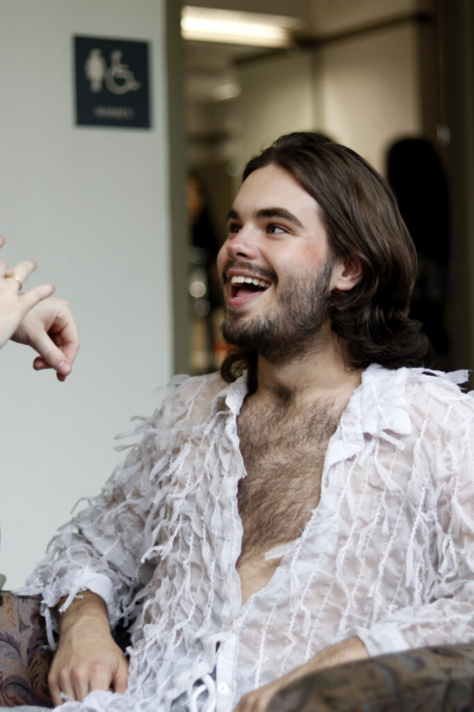 photo of jackson Riddle smiling at his makeup artist